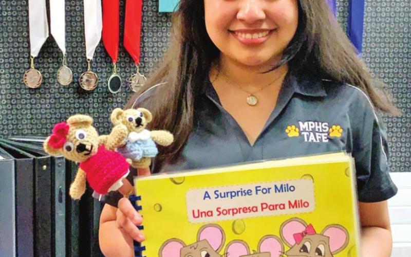 Monserrat Rivero Sanchez with her national award winning PreK Children’s book.