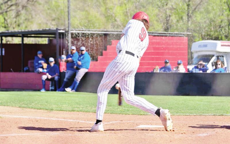 Bryce Wertz makes contact during last week’s game against Quitman. The Red Devils defeated the Bulldogs, 5-3. COURTESY PHOTO