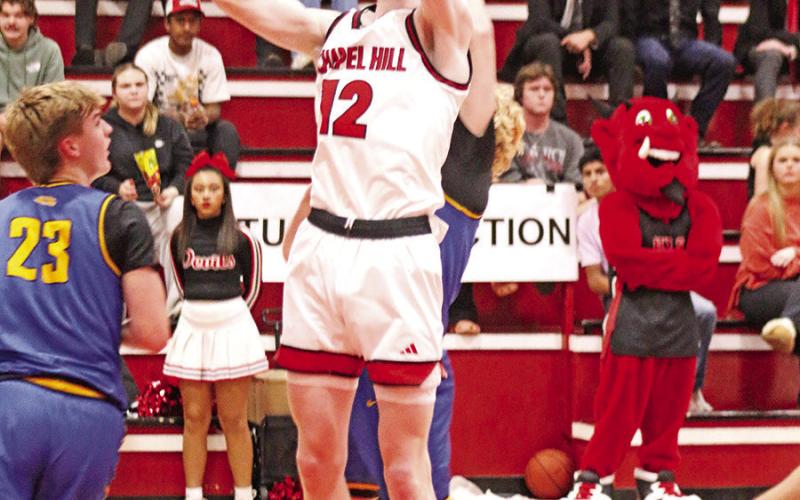 Senior Bryce Grisson (12) puts up a short jumper against visiting Sunnyvale last week.