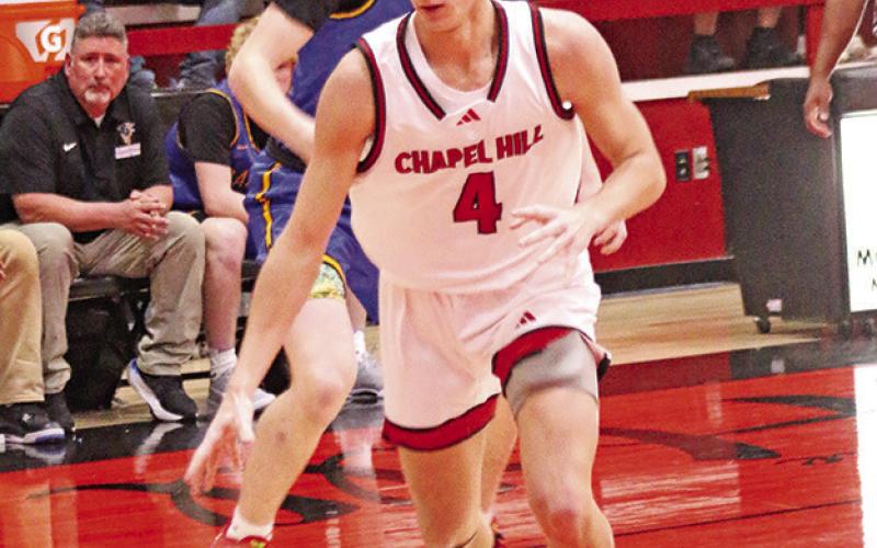 Chapel Hill senior Isaac Bailey (4) drives to the basket against Sunnyvale last week.