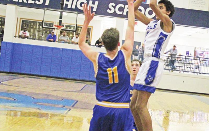 Rivercrest’s Tre Williams takes a shot during a recent game. The Rebels opened the playoffs Tuesday evening against Como-Pickton. TRIBUNE PHOTO / QUINTEN BOYD
