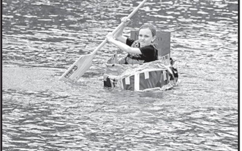 Fifth grader Anna Henry paddles her winning team’s boat in
