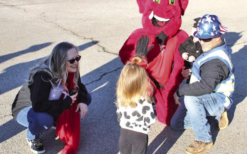 Chapel Hill’s mascot, the Red Devil, entertains kids during the groundbreaking
