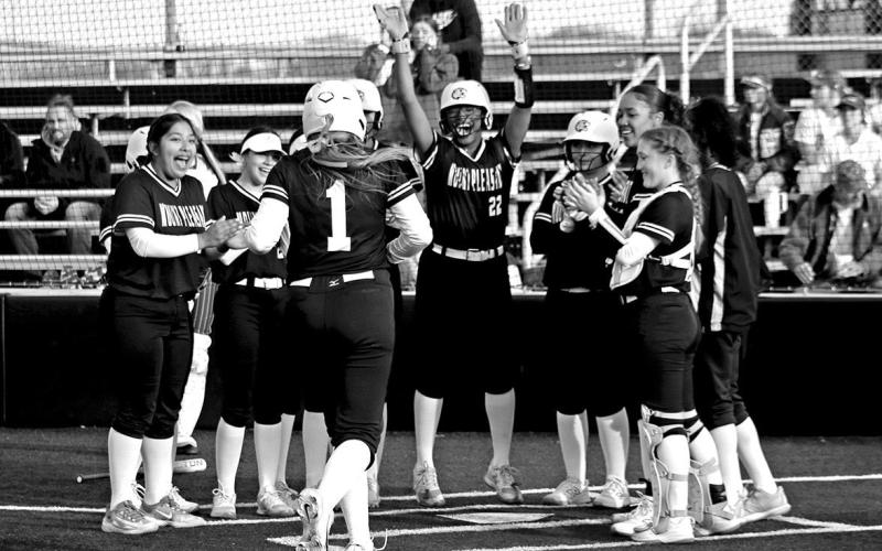 Mount Pleasant’s Kammie Terrell (1) is greeted at home after clobbering a home run against New Boston last week.