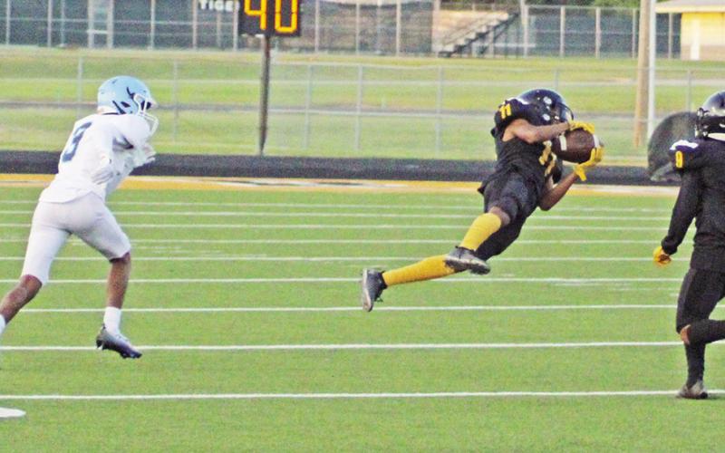 Mount Pleasant’s Dexter King lays out to make a catch during last week’s game against Frisco Emerson.