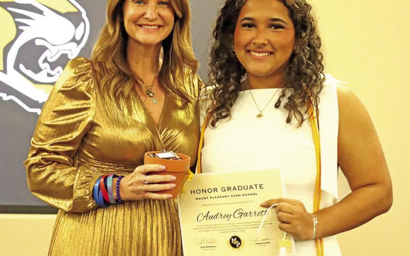 Honor grad Audrey Garett with Tiger Doll Director Jaton Broach