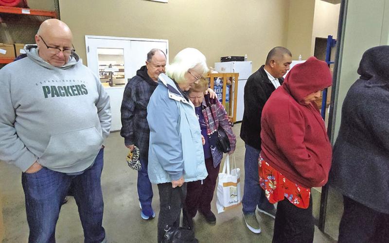 Starting the new year right: Titus County Cares holds prayer walk through pantry