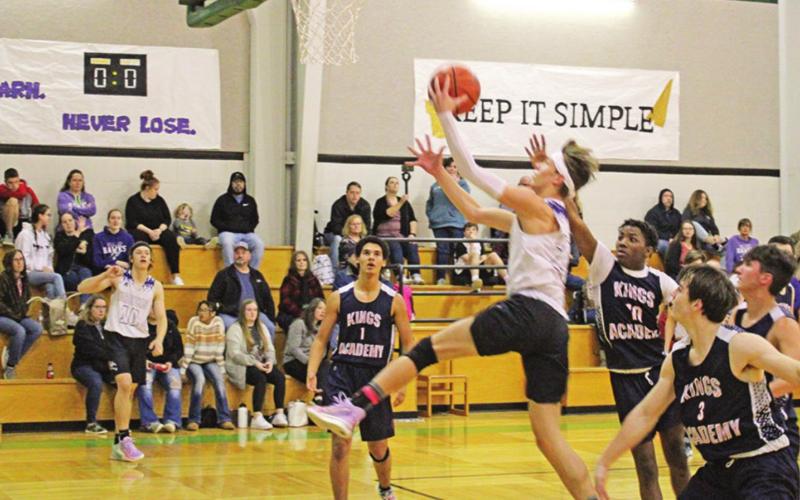 Caelan DeLisi drives for a layup during the JV game. TRIBUNE PHOTO / QUINTEN BOYD