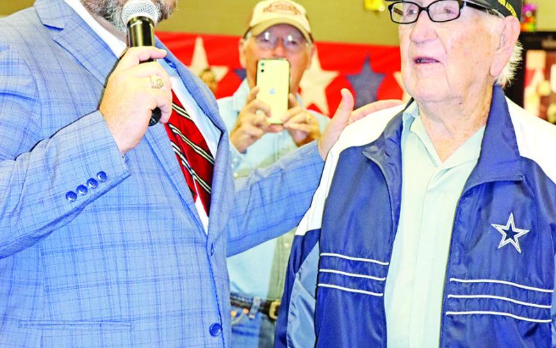 Wallace principal, Nathan Rider (left), recognizes World War II veteran, Ellis Moore COURTESY PHOTO