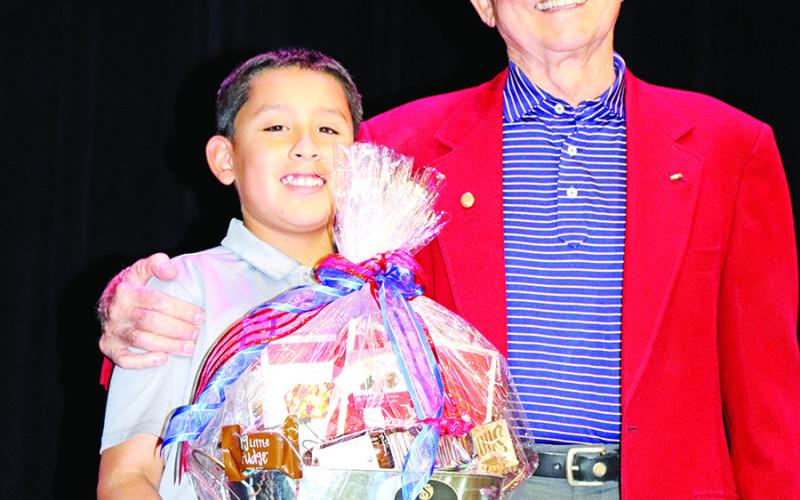 Wallace Student Council President, Jimmy Aguilar (left), presents Keynote Speaker, E. Ridley Briggs, with a token of appreciation