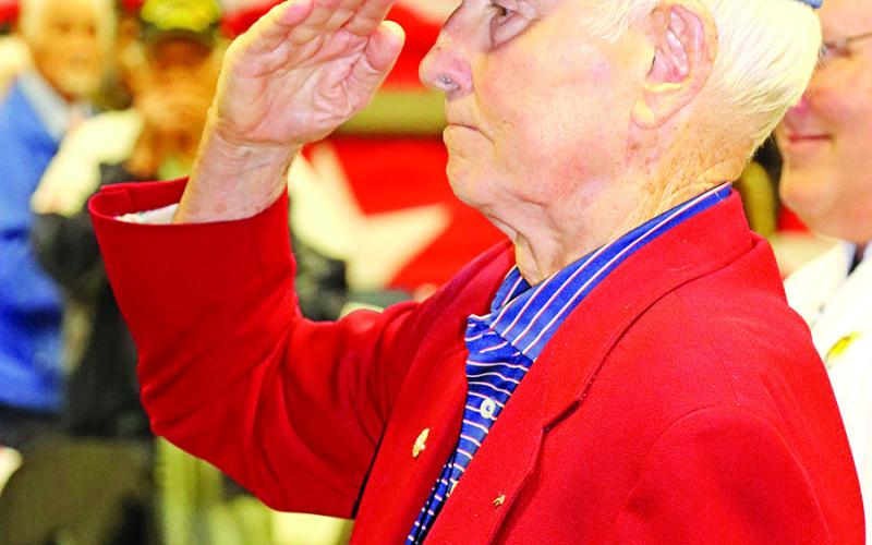 Air Force veteran, E. Ridley Briggs, salutes the flag at the conclusion of the program COURTESY PHOTOS