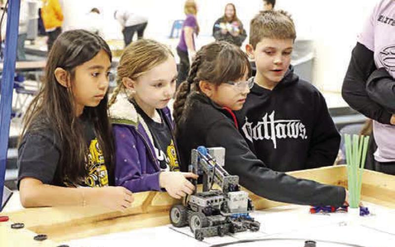 The Brice Capybaras (L to R) Heasly Reyes, Anna Henry, Avalyn Netro, and Judah Deal, set up for their qualification match