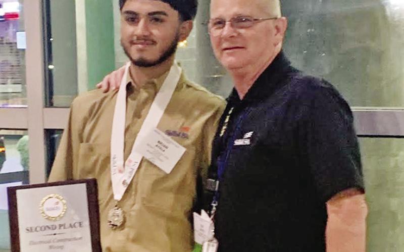 Brian Ayala (left) and MPHS Electrical Technology instructor Tim Davis (right) COURTESY PHOTOS