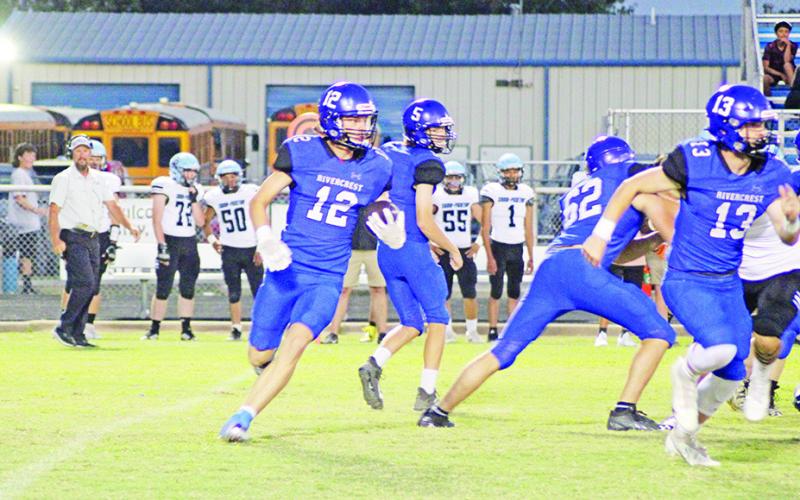 Mark Grider looks for yardage during a recent game. Grider had three catches for 133 yards and a touchdown and picked off a pass for the Rebels, who take on Alba-Golden Friday. TRIBUNE PHOTO / QUINTEN BOYD