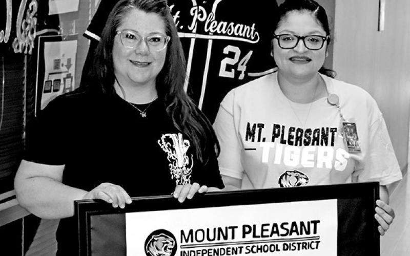 Accepting the TAEA District of Distinction for MPISD (L to R) MPHS art teacher Laura Kirkland, MPISD Director of Fine Arts Theodus Luckett III, MPJH art teacher Blanca Hernandez