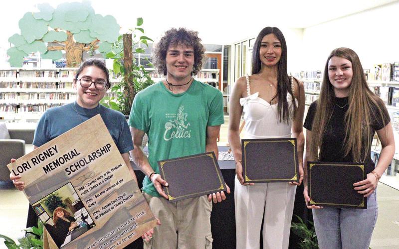 From left to right: Library Director Lupe Herrera, Maddox Lynch, Madelain Salazar, and Phenyx Reust.