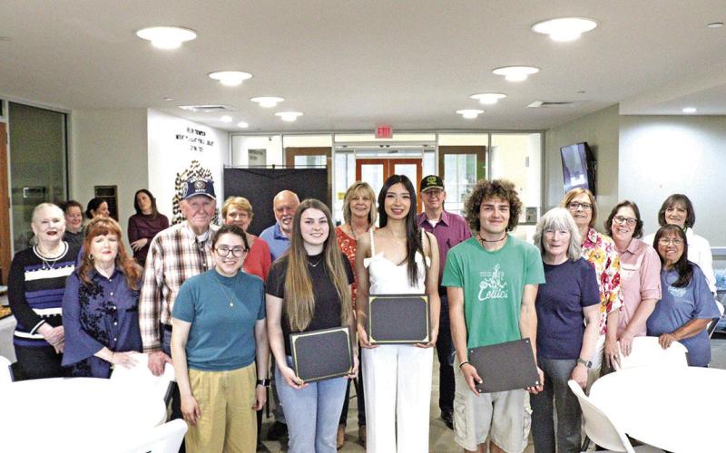 Friends of the Mount Pleasant Library present Lori Rigney Scholarship winners.