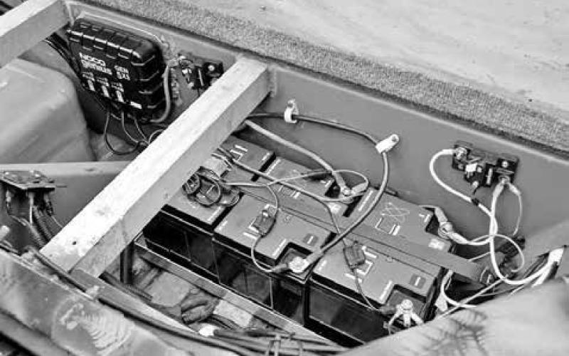 Tucked away neatly in the rear compartment are three lightweight lithium batteries, a pair of 60-amp circuit breakers, an onboard charger, automatic bilge pump and a 6 gallon removable fuel cell. The former 12-volt electrical system was converted to 24-volt system to support a powerful trolling motor and to handle the draw of bigger and better electronic units and transducers.