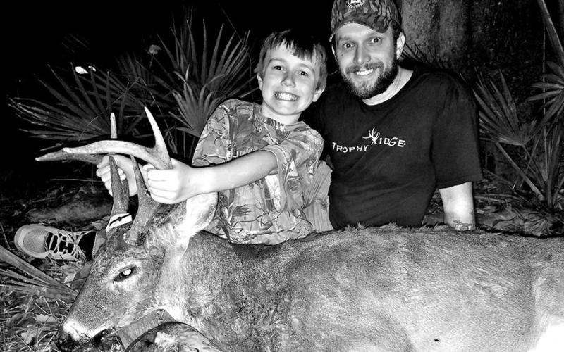 Justin Lanclos (right) and his 9-year-old son, Carter, experienced the dark side tree stand hunting in July 2016. Lanclos fell 22 feet from a lock-on platform, because he was not wearing a safety harness and safety line at the time. The fall resulted in a broken leg, shattered knee and other injuries that lead to multiple surgeries and a world of hurt. (Photo courtesy Justin Lanclos)