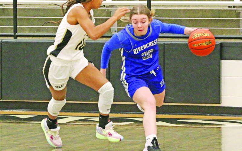 Rivercrest’s Anna Duvall looks to get around Pittsburg’s Breana Clark during Monday’s game. The Lady Rebels claimed third place at the North Hopkins Tournament, but fell on the road to the Lady Pirates. TRIBUNE PHOTO / QUINTEN BOYD