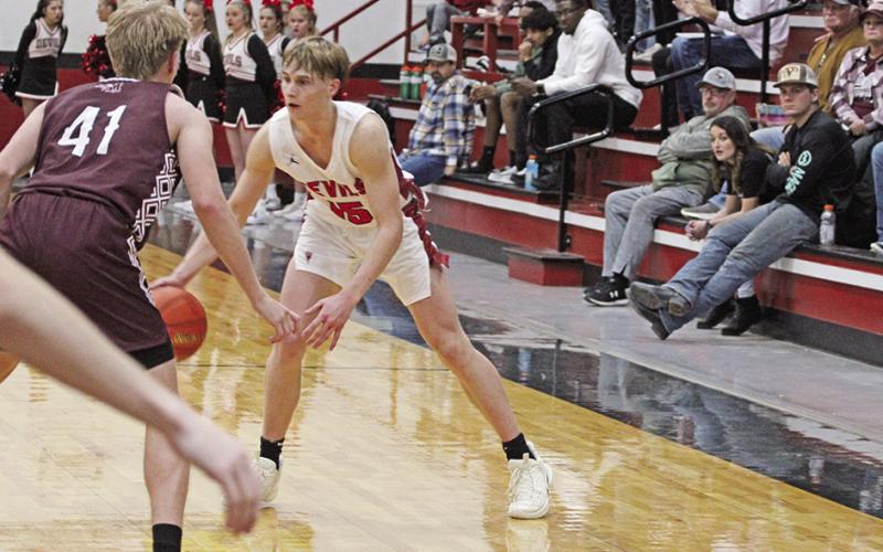 TRIBUNE PHOTO / QUINTEN BOYD Chapel Hill’s Braden Buchanan sets up the offense during a recent game. The Red Devils played in Tyler against All Saints Tuesday and will take part in the Edgewood Basketball Invitational this weekend.