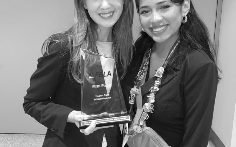 Natalie Crockett (left) with her national fifth place trophy and national finalist Mea Banda (right). COURTESY PHOTO