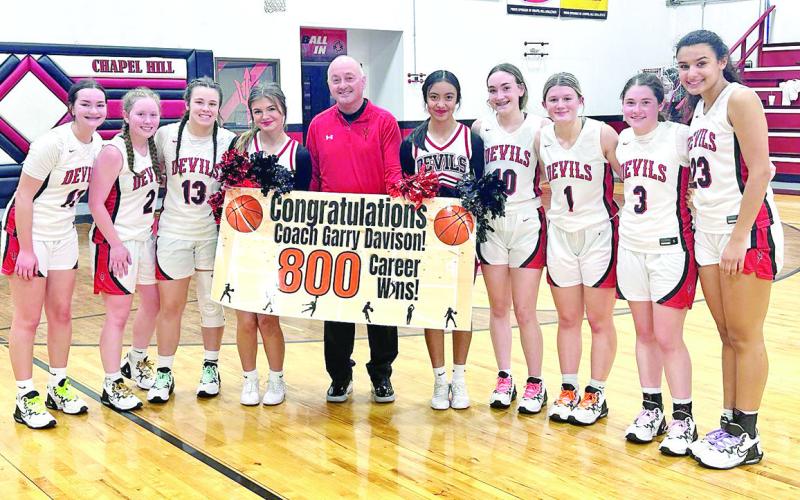 COURTESY PHOTOS The Chapel Hill Lady Devils celebrated milestones reached by two of their own Tuesday night following the team’s home win over Daingerfield. Senior Katie Hart scored her 1,000th point as a member of the Lady Devils. Also, Head Coach Garry Davison picked up his 800th career coaching win. Both Hart and Coach Davison looked to add to their totals over the weekend as the Lady Devils took part in the Winnsboro Hoopfest.