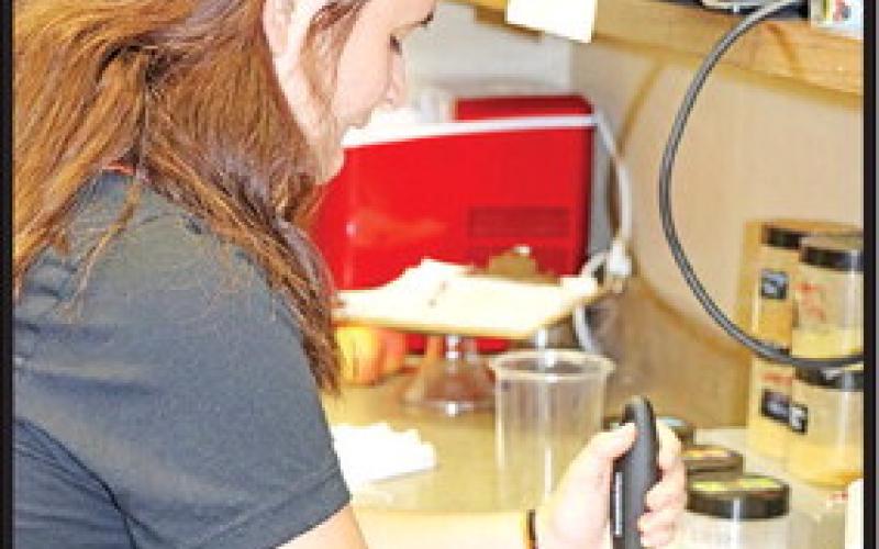 Jenna Mars makes tea in the Tigers Cup coffee shop.