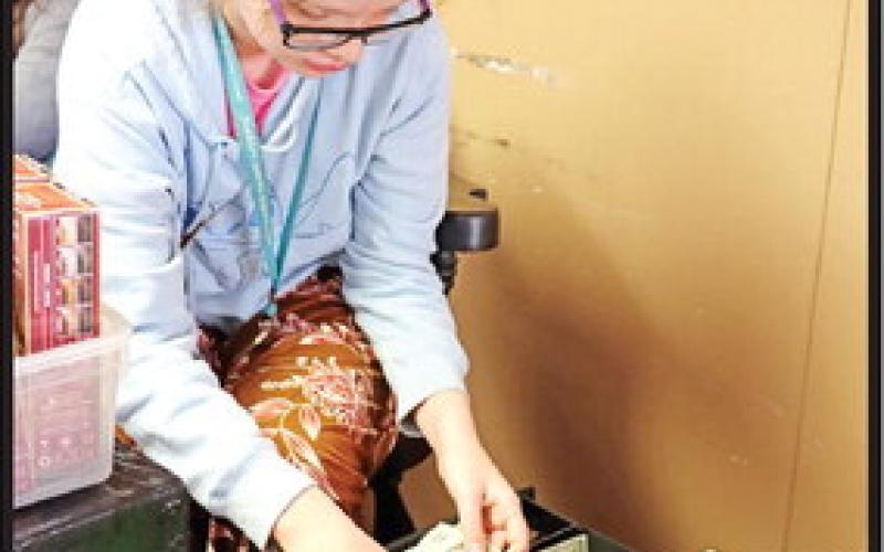 Sarah Baxter makes change for a customer.