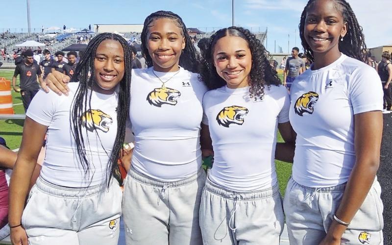 The Mount Pleasant Lady Tiger 400-meter relay squad of Tyia Allen, Shannon Hines, KK Brannon and Anna Norman took the gold medal at the Tiger Relays last week with a time of 49.5. Lady Tiger Head Track &amp;amp; Field Coach is Travis Buchanan with assistants Crystal Jackson-James, Martina Ramirez and Jessica Stanley. COURTESY PHOTO