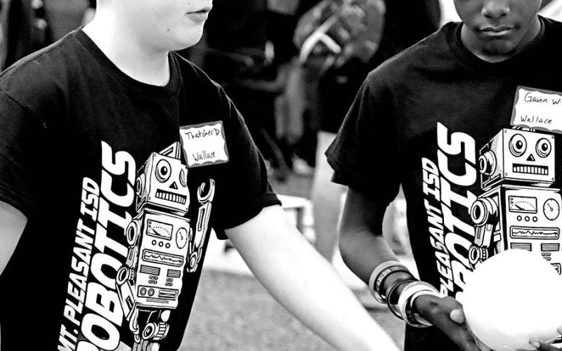 Wallace Team 3 members Thatcher Drange (left) and Gavin Williams discuss strategy