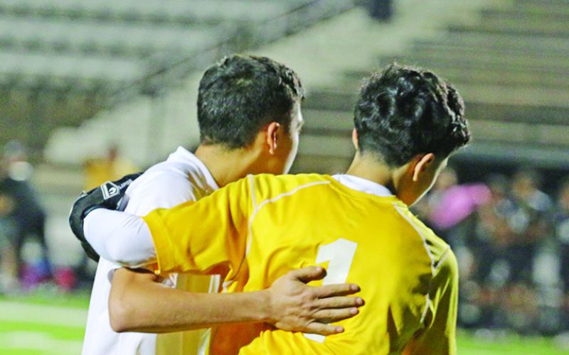 Nathan Gandara (left) encourages Edgar Lopez after Gandara scored during penalties. Lopez, a freshman, came up with a number of saves on Nacogdoches attacks, including a leaping effort at the end of the first period of extra time and two saves to help Mount Pleasant get back into the game during the penalty shootout. Gandara and Erick Soto scored during penalties for the Tigers.