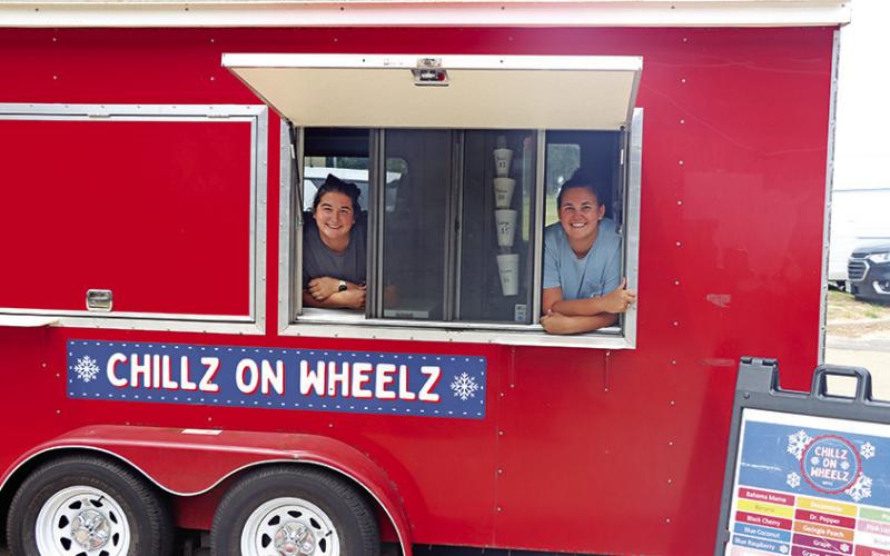 Representatives from Hospitality ER gave away free ice cream for dessert. Chillz on Wheelz owners, Sarah Flanagan (left) and Rachel Narramore, set up outside the cafeteria during lunch to offer staff members a cool treat. COURTESY PHOTOS