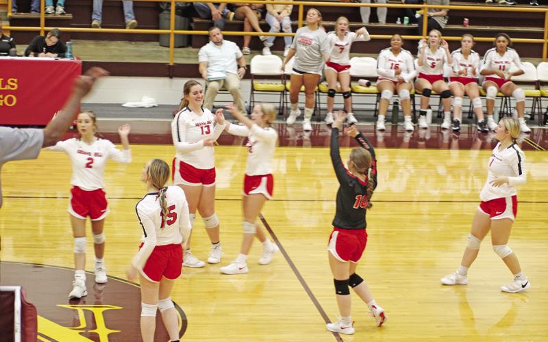 Members of the Chapel Hill Lady Devils celebrate a point during Tuesday’s match against New Boston. Team members pictured, from left, are Emily Dixon, Keira Hawkins, Abigail Thrapp, Ella Waldon, Hannah Rhea and Kaylee Tompkins. TRIBUNE PHOTO / QUINTEN BOYD