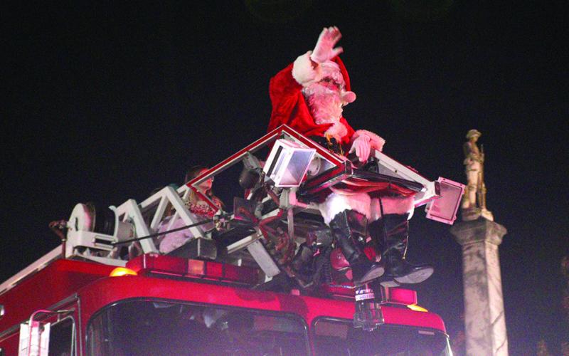 Parade finale features Santa Claus wishing everyone a Merry Christmas.