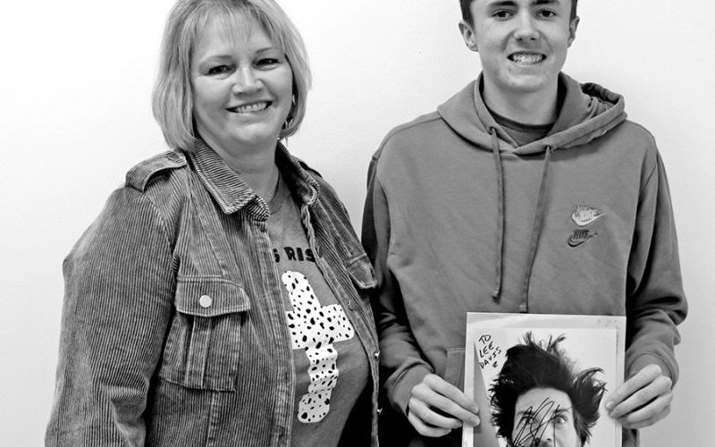 BIM I instructor Jackie Scoggins with Lee Davis holding the autographed photo from L.A. Beast. COURTESY PHOTO