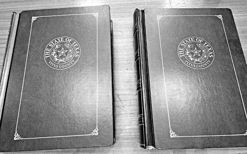 Two deed books presented in memory of past county employees