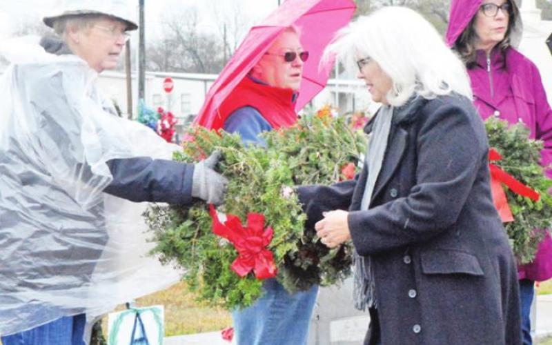 Volunteers lay wreaths on gravesites at last year’s Wreaths Across America event here in Titus County. Pictured are Netta Walker, Mavis Brush, Jammie Barker and Diane Patrick COURTESY PHOTO / HUDSON OLD, EAST TEXAS JOURNAL