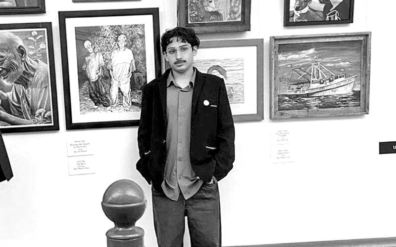 (L to R) Josue Vega standing next to The Boys now on display at the U.S. Capitol in the Cannon Tunnel