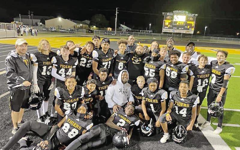 The 7th grade Tiger football team won the district championship on Tuesday, November 5, capped off with an undefeated season. They are coached by Will Hallonquist, Jared Elliott, Jakeivian Hughes, Hugo Uribe, Josh Morris, Jackie Ouzts, Ira Franklin, and Joel Guerrero. COURTESY PHOTO