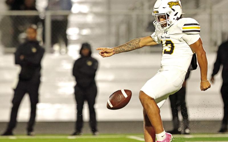 Tiger Punter Gerardo Chavez prepares to punt the ball away on 4th down.