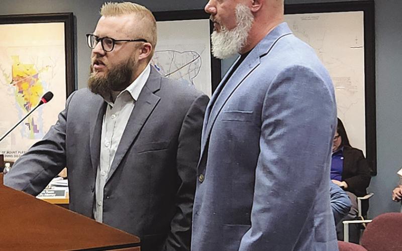 Owner of Brian Information Technology and his brother speak to council on Dec. 17