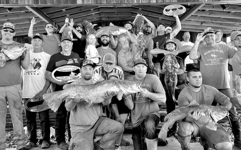 Catfishermen gather on the weigh-in stage during the 2022 Neches River Life event, where $$4,500 was awarded to the winners. This year’s event is set for April 14-15. COURTESY PHOTO / DAVID HOLLAND