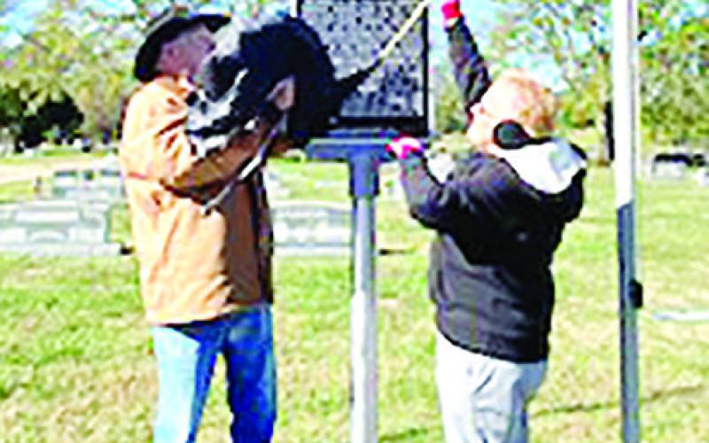 Vietnam Veteran, John Mears and Association treasure/secretary, Gena Gage, reveal historical monument.