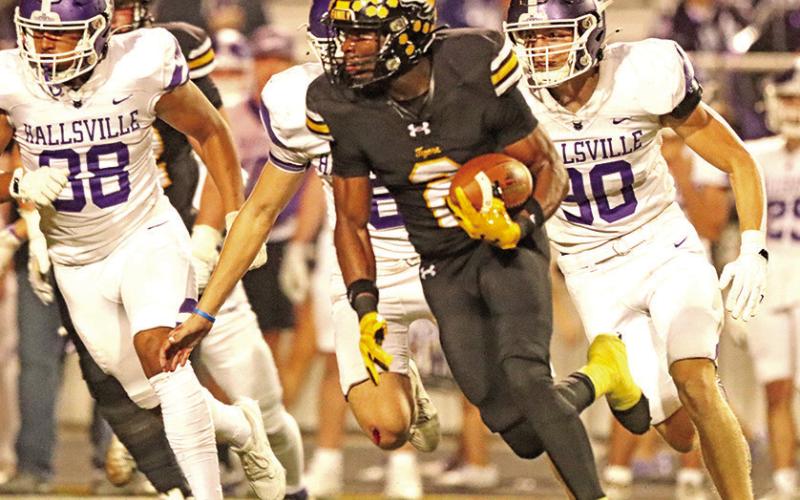 Decorian Thompson makes a move after securing the pass. Thompson surpassed 1,000 yard receiving mark during the win over Hallsville.