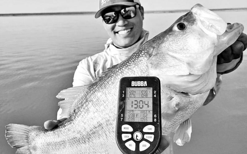Lawrence Lee of Tolar with a 13.04-pound beauty caught on July 19 at Lake J.B. Thomas near Snyder. Lee has caught two other bass over 13 pounds at the lake since January and 11 other fish between eight and 10.4 pounds since June that are documented Toyota ShareLunkers. Most were caught while fishing with guide Christian Gladfelter. (Slaunched Guide Service)