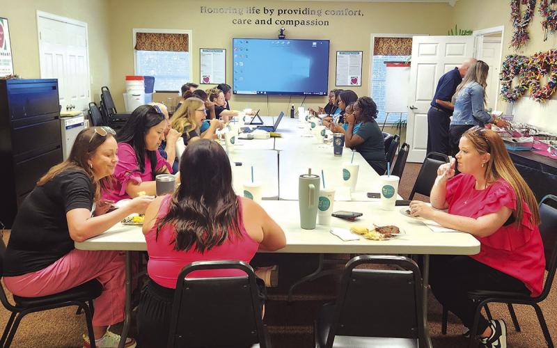 Hospice employees enjoy a well-deserved BBQ lunch to celebrate their Elites award. COURTESY PHOTO