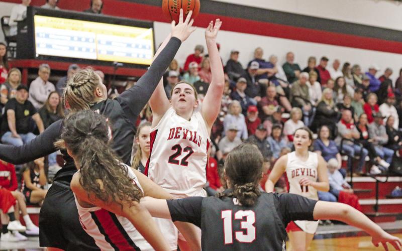 Chapel Hill’s Abigail Thrapp puts up a shot over Winnsboro’s Faith Acker during Tuesday’s game. The 18th-ranked Lady Raiders picked up the win over the 11th-ranked Lady Devils, 49-38.
