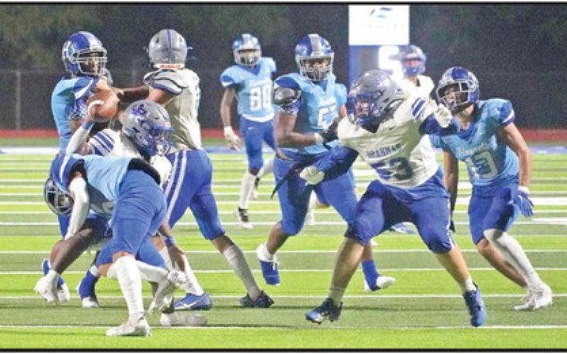 Pewitt’s Junie Johnson is brought down after a gain during Friday’s game at Hooks. BEE PHOTOS / TONY BASSO