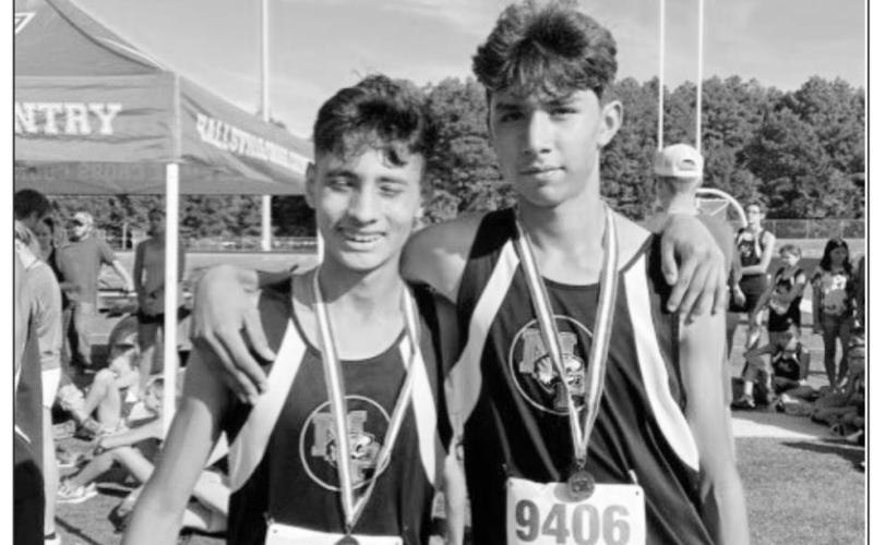 Enrique Marrufo and Gilbily Landaverde show off their top ten medals. COURTESY PHOTOS